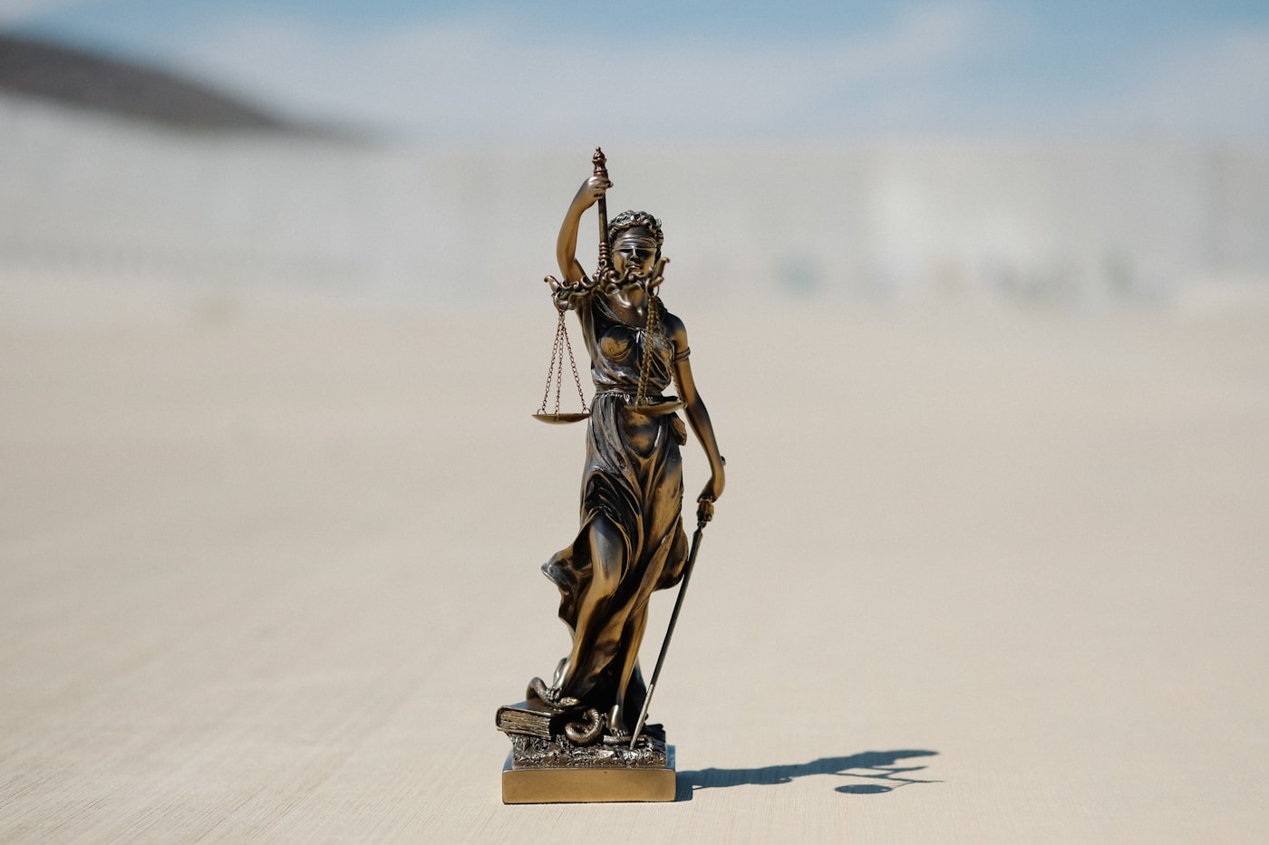 Lady Justice statue representing fairness and competition
